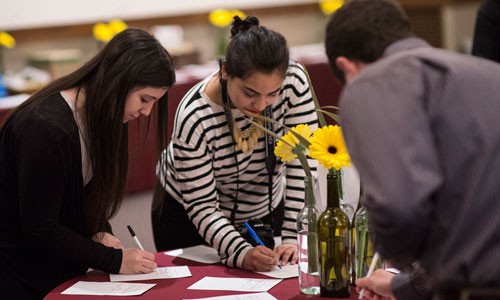 Students bidding at PILF auction