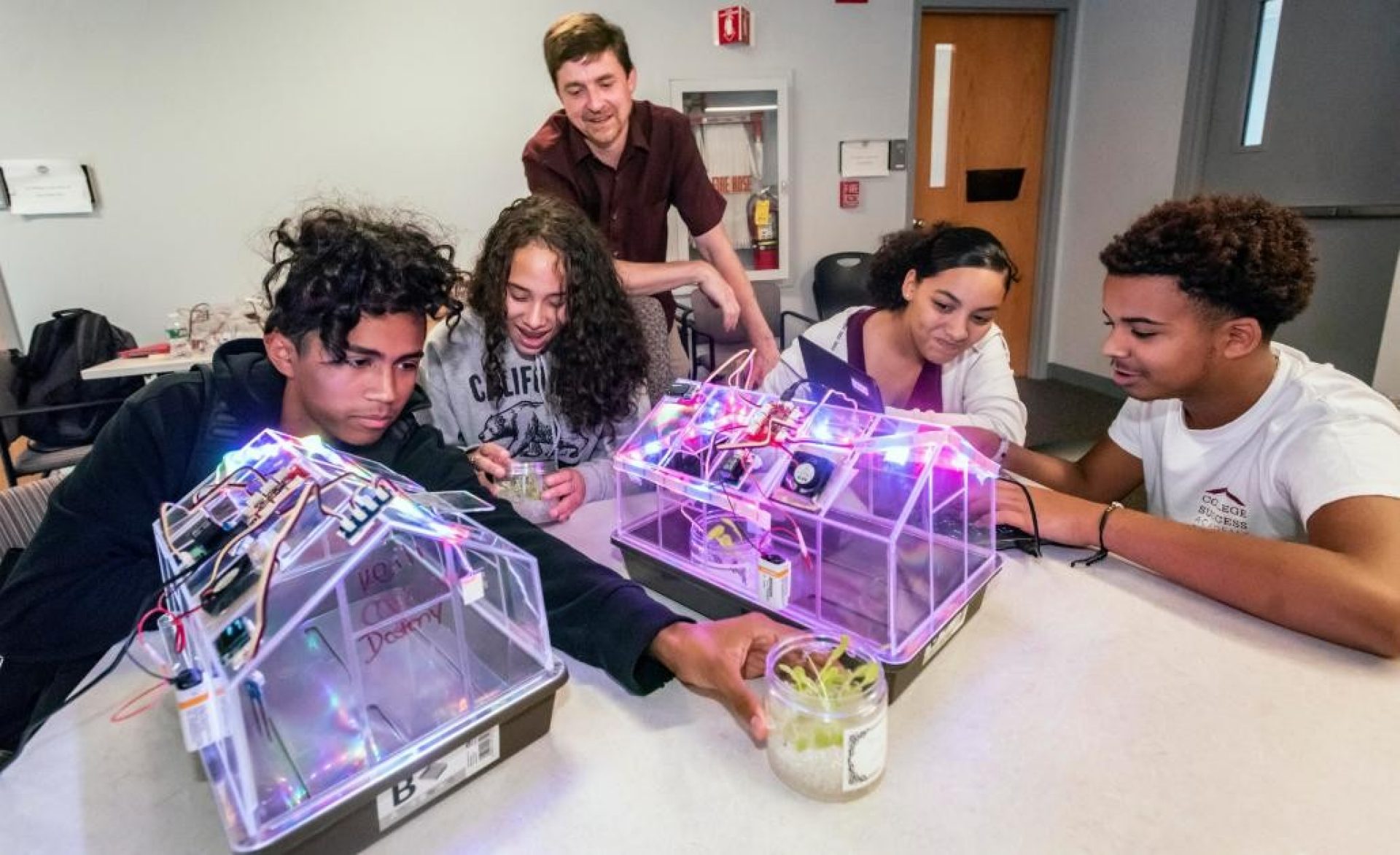 Professor Mike Barnett works with students