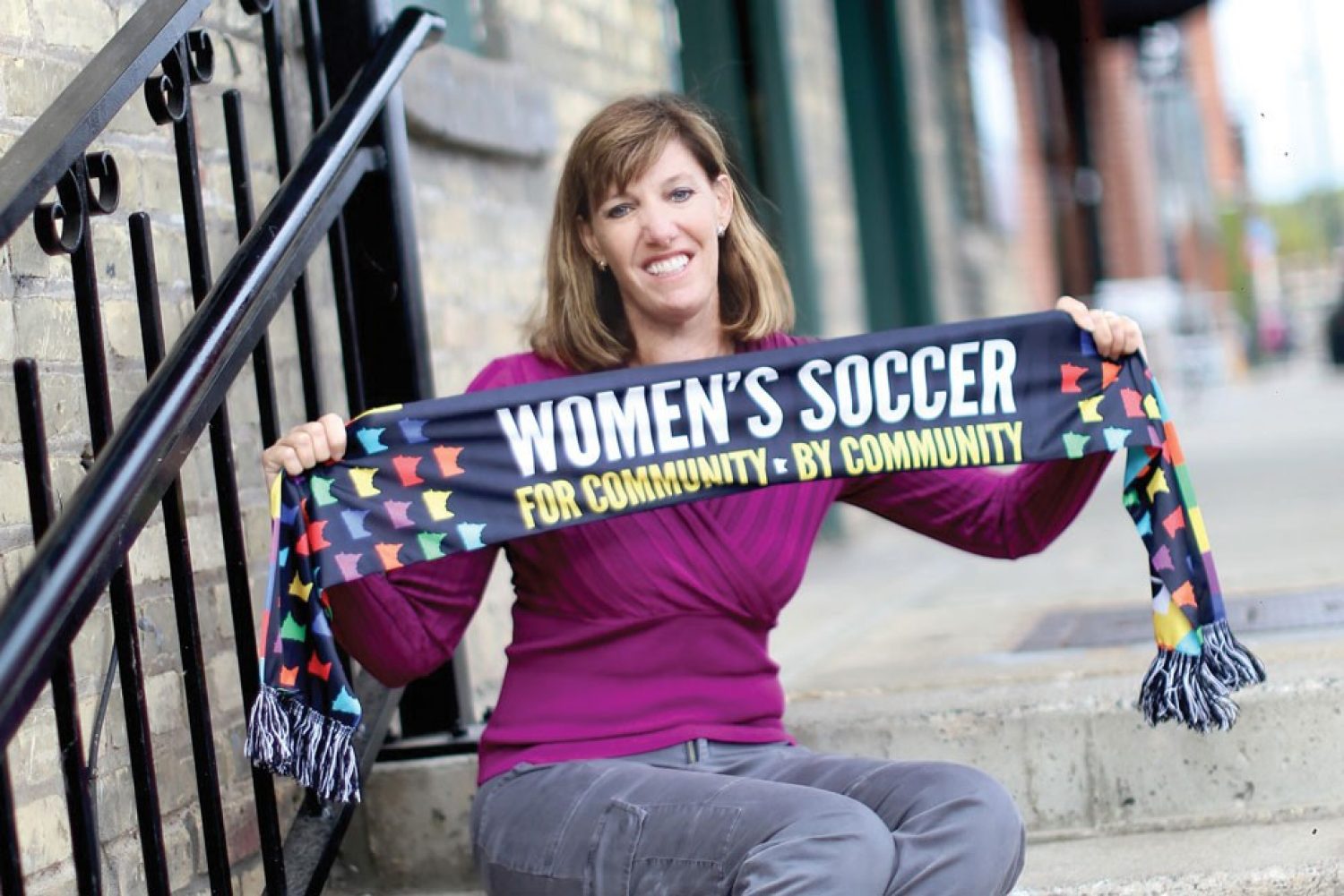 Andrea Yoch ’89 photographed holding soccer scarf