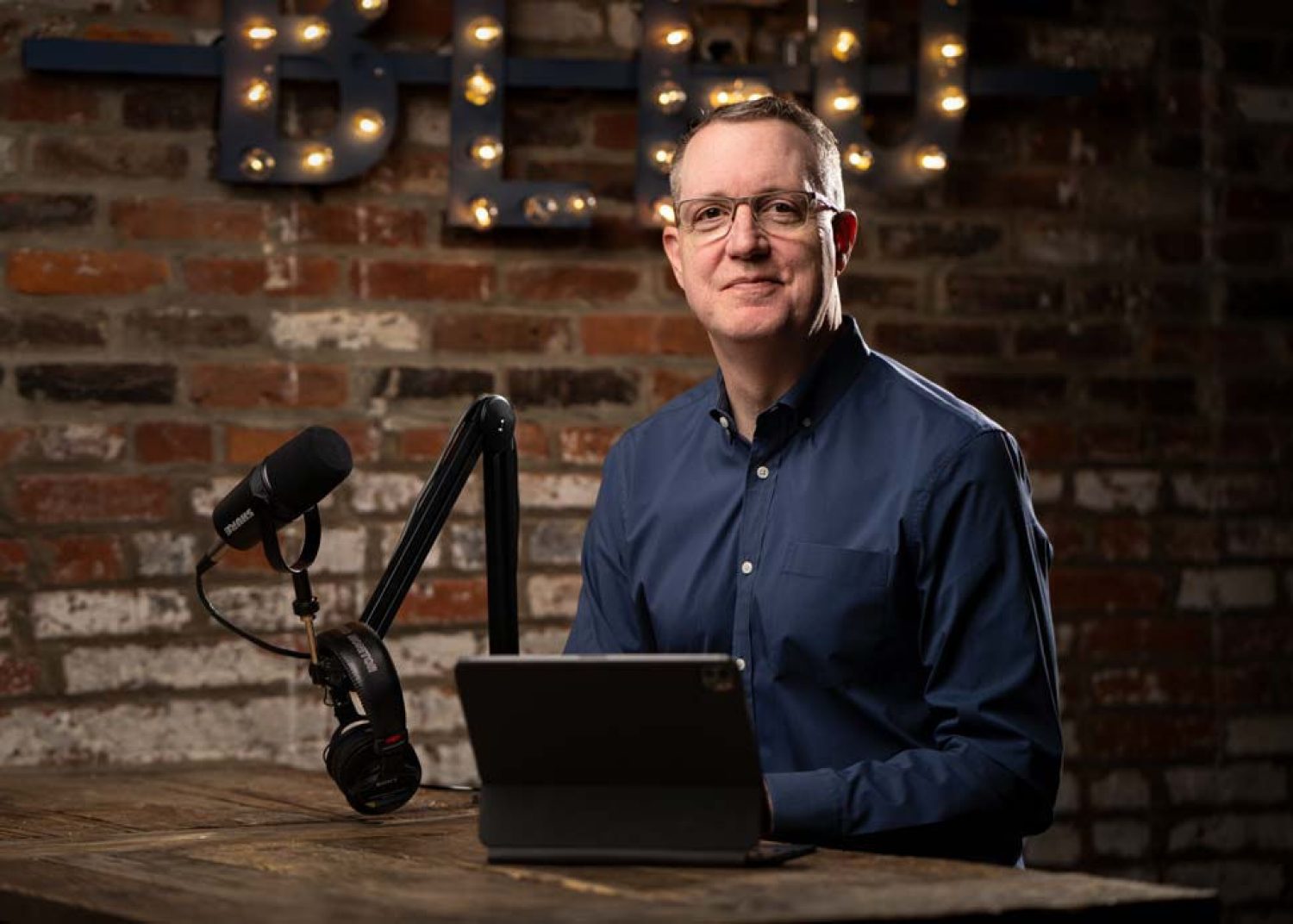 Photograph of Chris HIll in an audio studio