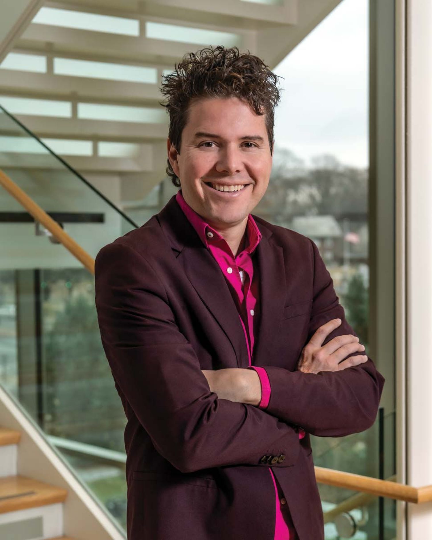 Serazio photographed with receding stairwell and skyline in background