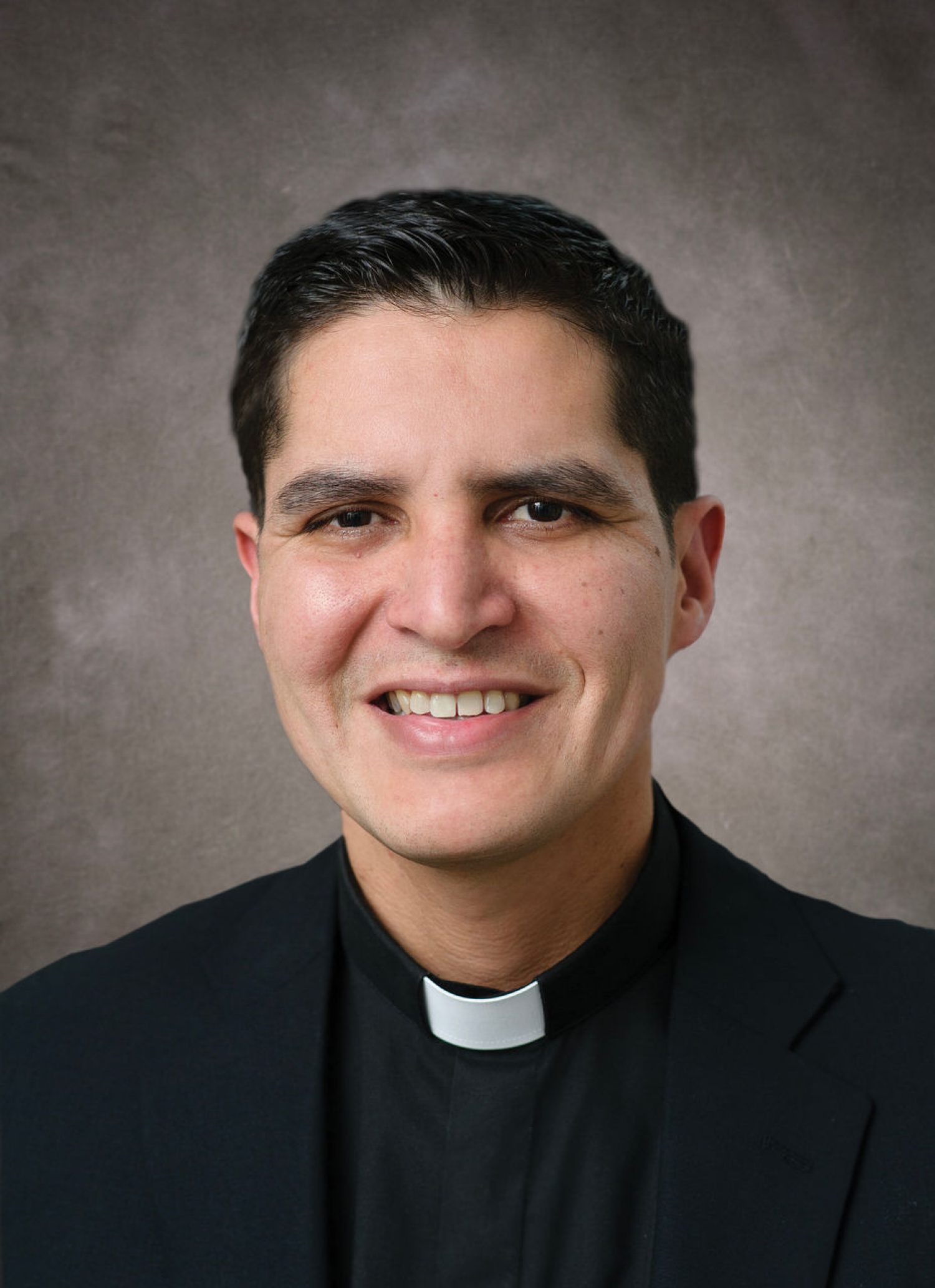 Erick Berrelleza in clerical collar