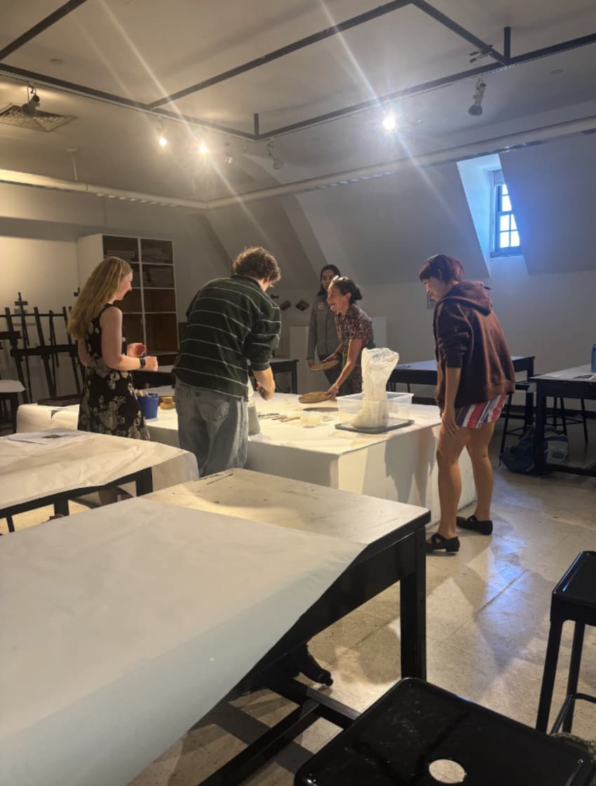 Group of students presenting their pottery