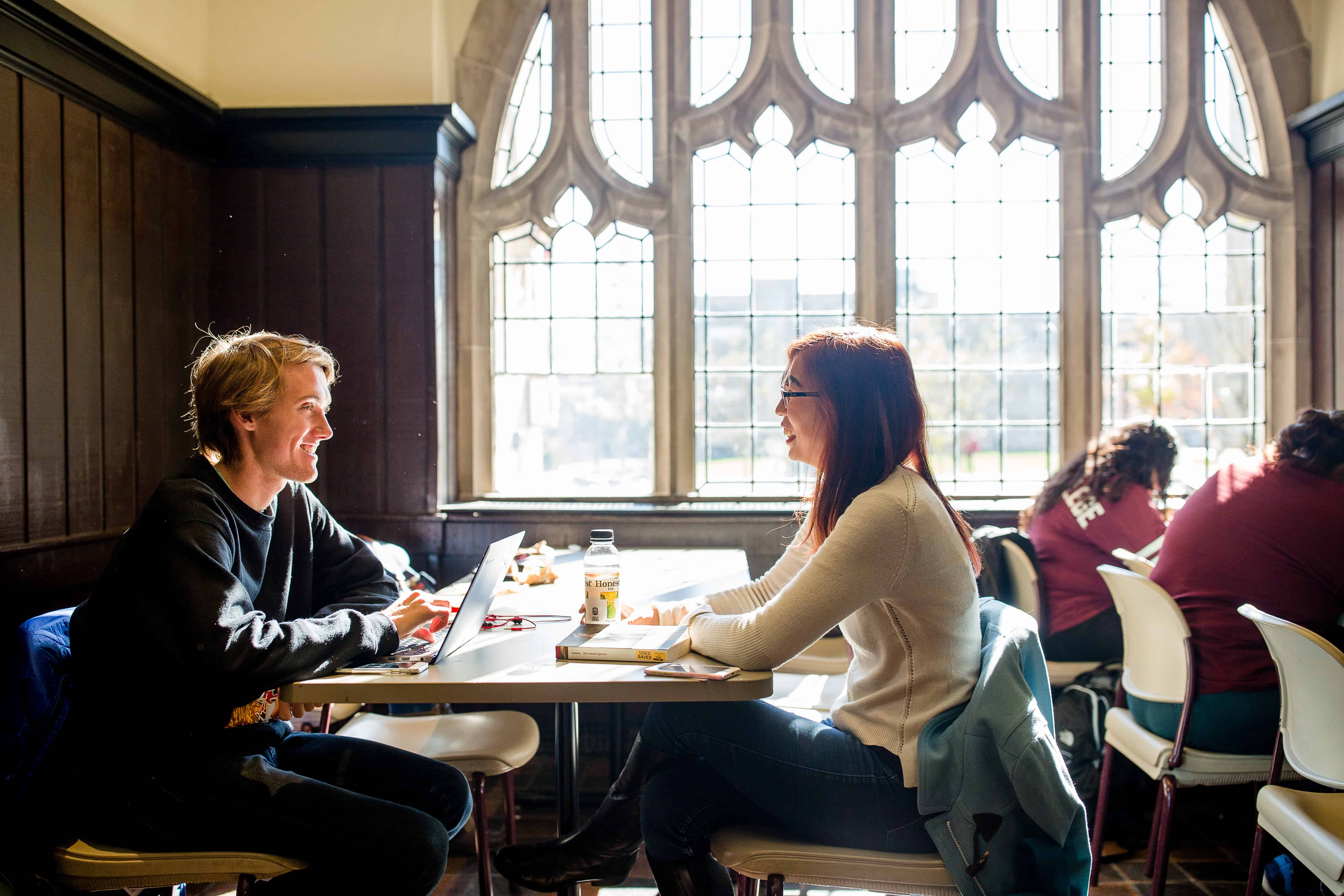 Students by window talking