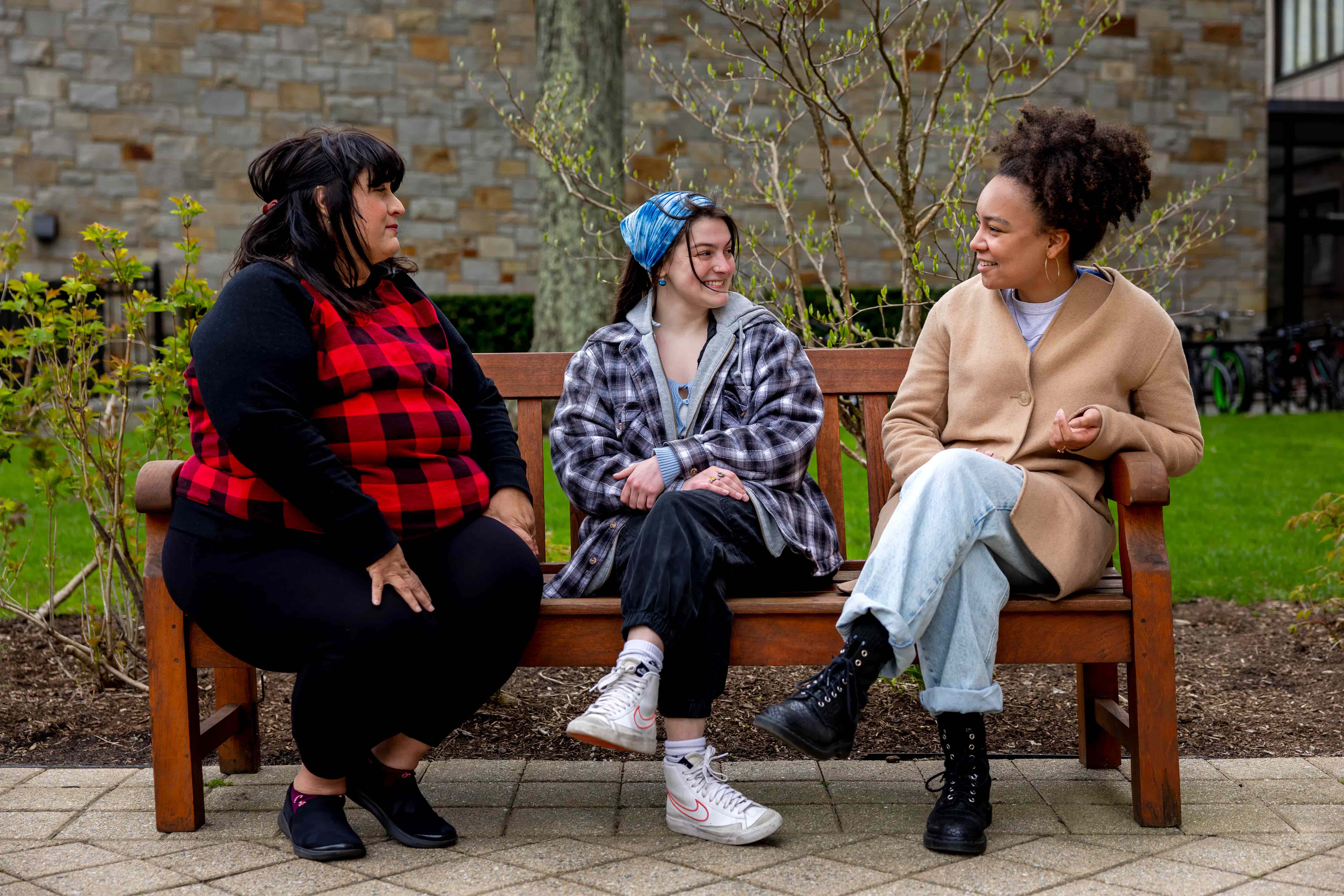Students sitting outside discussing