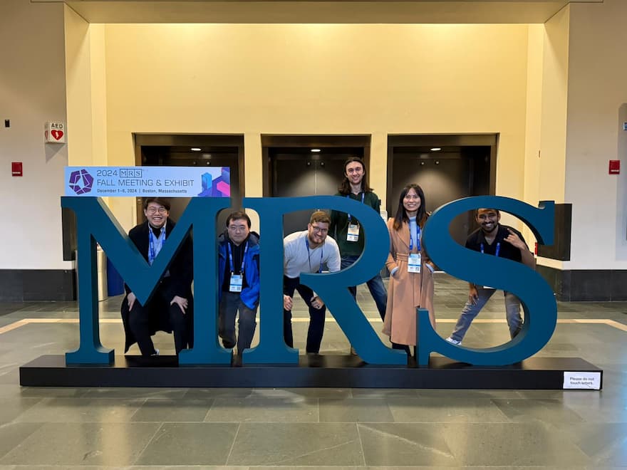 Most of the team posing at MRS for a photo.