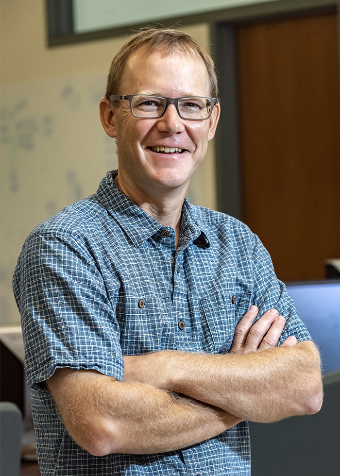 Assoc. Prof. Mark Behn (E&ES), newly appointed faculty member photographed in his offices for Kalscheur SJ slide show and a future issue of Chronicle.