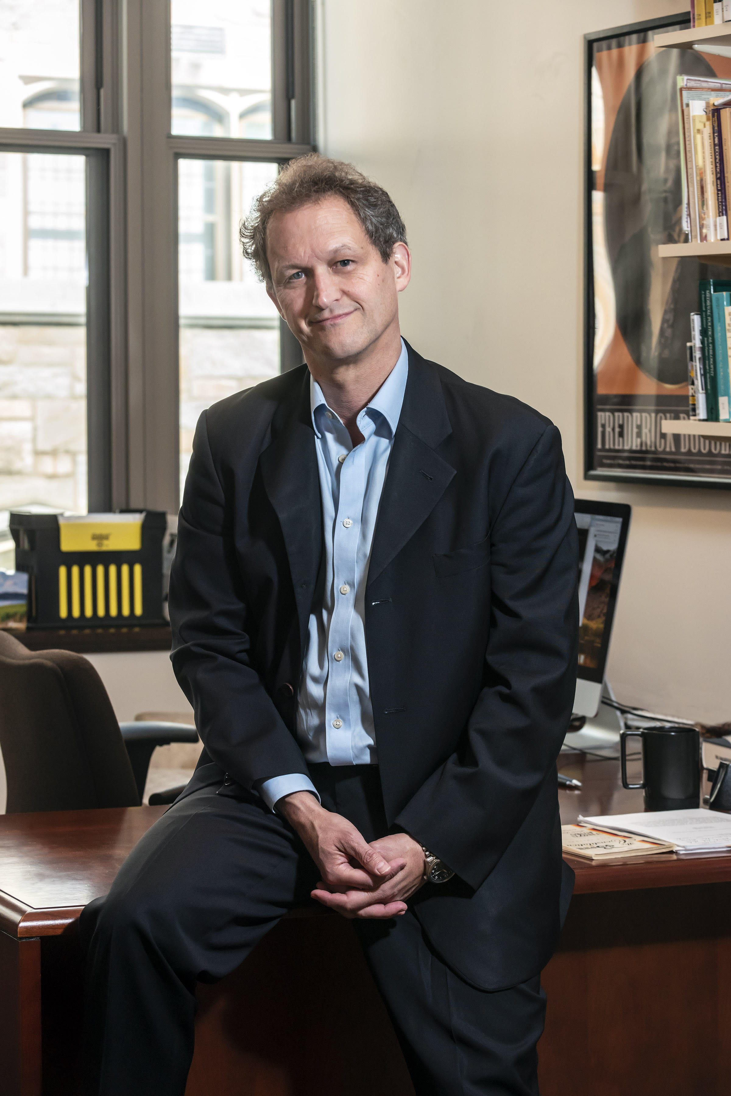 Prof. Greg Fried, newly appointed professor of Philosophy, photographed in his office and outside Stokes for use in Kalscheur SJ web slide show and a future issue of Chronicle.