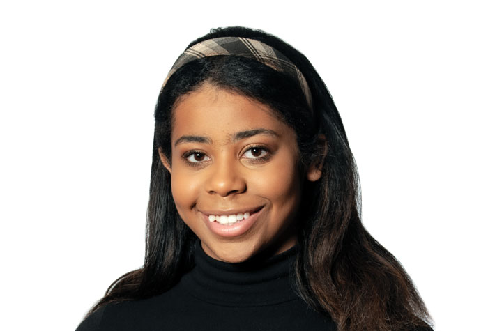 Tiffany Brooks with the star-shaped brooch nestled inside the book she found