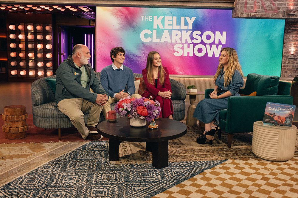 Three people behind interviewed on a daytime television show