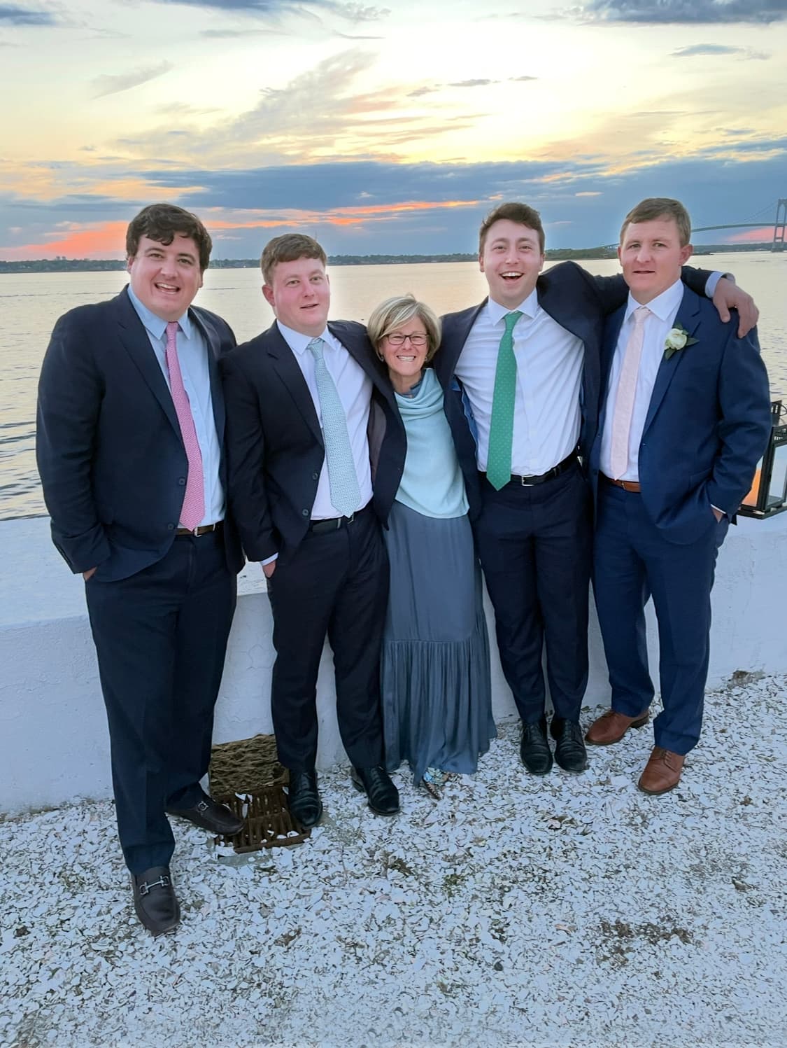 The Murray family standing on a beach